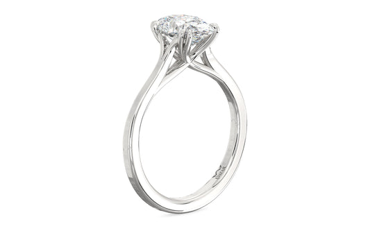Golden oval solitaire diamond ring with twisted double prongs, symbolizing timeless love and romance.