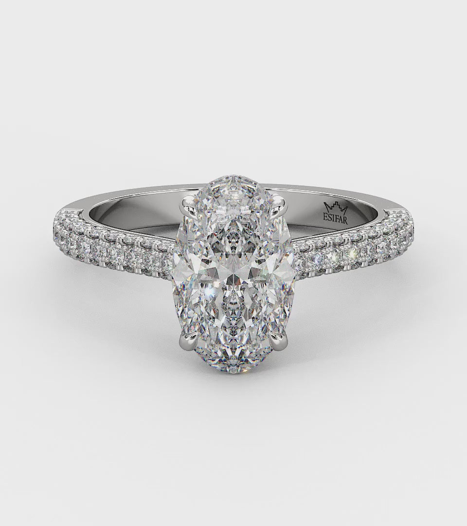Customizable golden engagement ring with a hidden halo, round brilliant diamonds, and a maxed diamond band for added brilliance and elegance. 