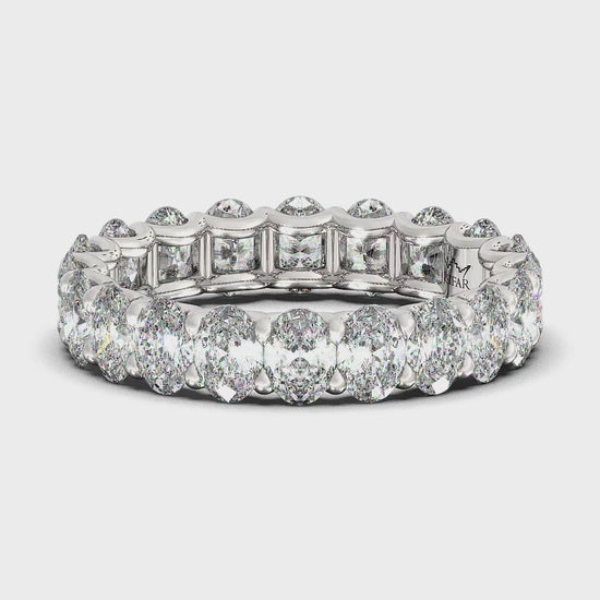 Ovals in U-Gallery Eternity Ring : Dazzling eternity ring featuring a continuous row of shimmering oval diamonds in a U-Gallery setting.  This expertly crafted ring is designed for maximum sparkle and brilliance, embodying timeless elegance and luxury.