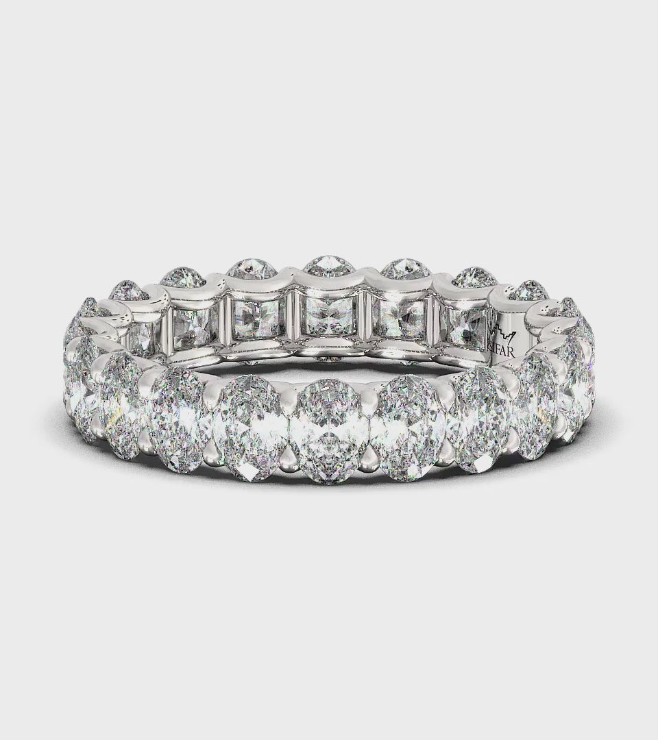 Ovals in U-Gallery Eternity Ring : Dazzling eternity ring featuring a continuous row of shimmering oval diamonds in a U-Gallery setting.  This expertly crafted ring is designed for maximum sparkle and brilliance, embodying timeless elegance and luxury.