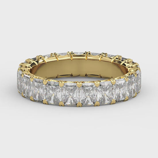 Golden radiant-cut diamond eternity ring in a refined U-Gallery setting, crafted for exceptional sparkle and timeless elegance.