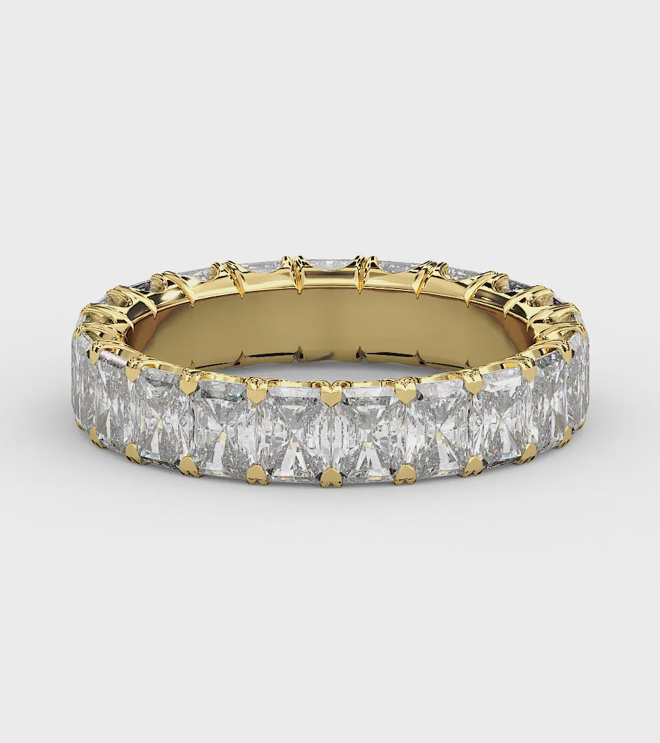 Golden radiant-cut diamond eternity ring in a refined U-Gallery setting, crafted for exceptional sparkle and timeless elegance.
